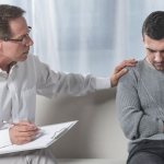 Man with depression visiting a psychotherapist