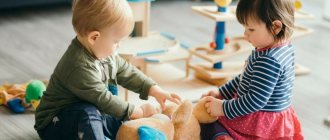 children play with a teddy bear