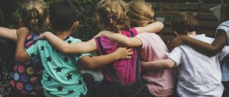 children sitting hugging