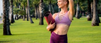 Girl in nature with yoga mat