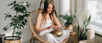 Girl sitting in a chair in lotus position