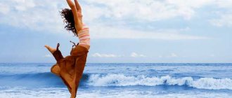 Girl dancing on the shore