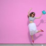 Girl in a white skirt jumping