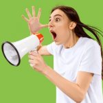 Screaming girl with a megaphone on a pale green background.