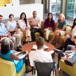 Participants in psychological training sit in a circle